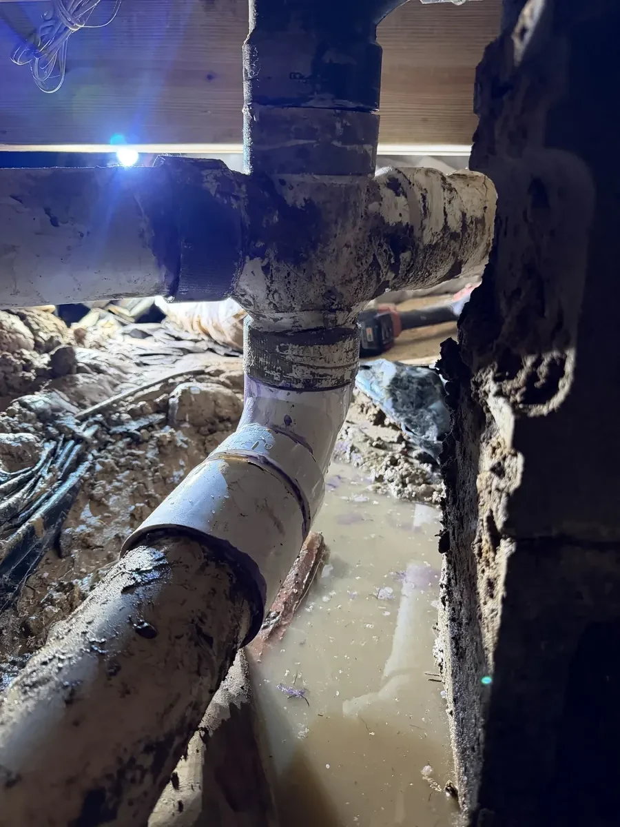 Broken sewer pipe under the house replaced on County Road 2121 in Longview, Texas