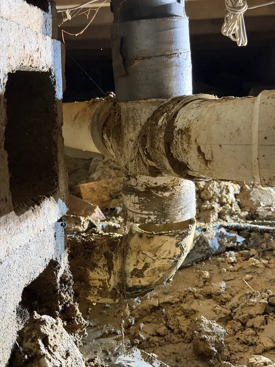Broken sewer pipe under the house replaced on County Road 2121 in Longview, Texas