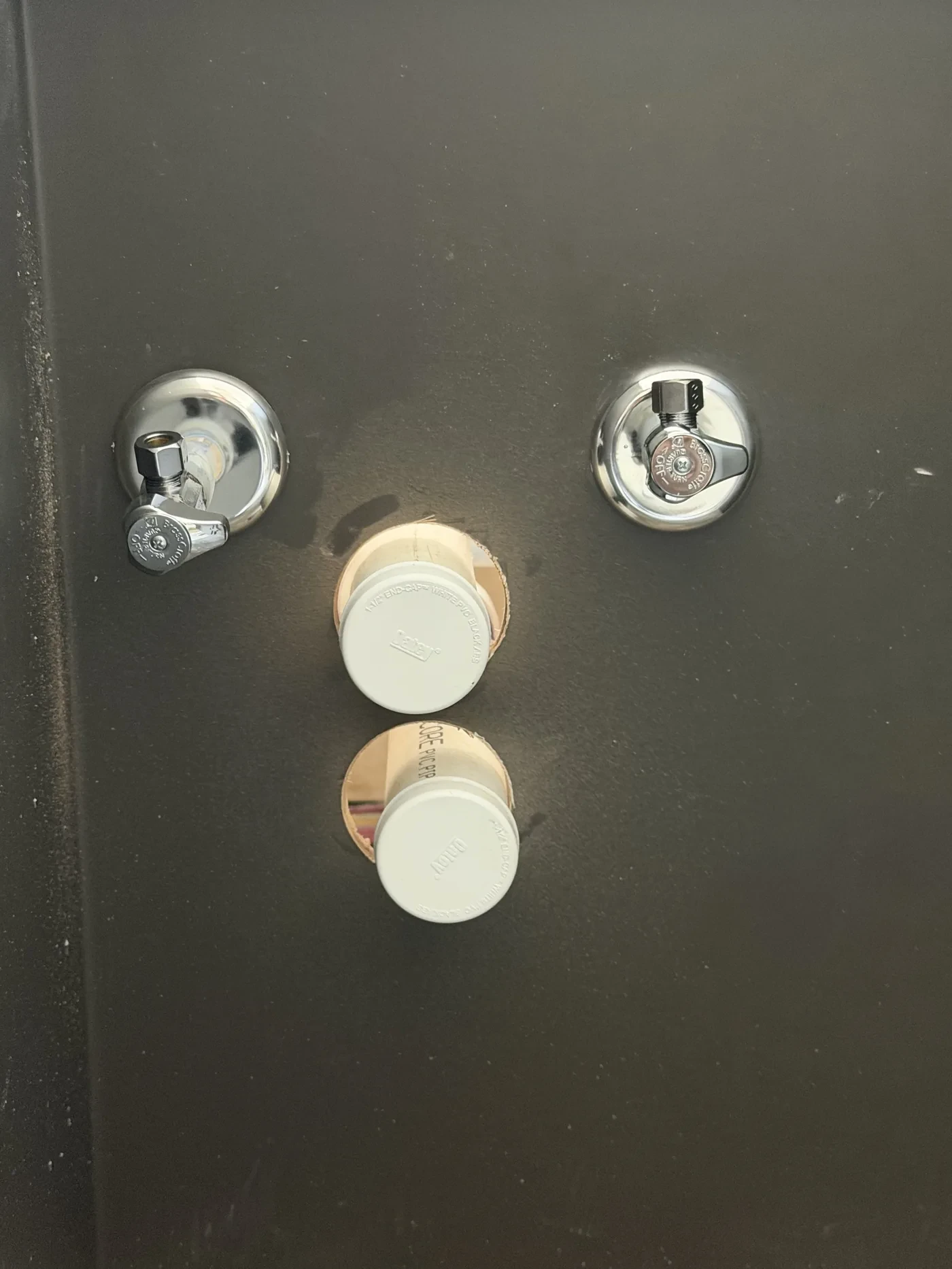 Shower valves with plaster guards still on, on Lakeside Lane in Tyler, Texas