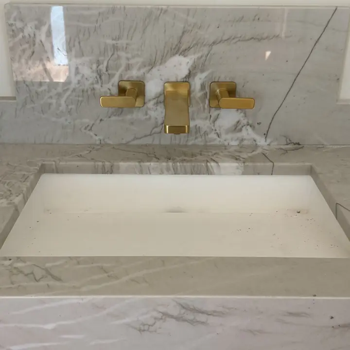 Luxury bathroom fixture installation in Tyler TX - marble sink with gold fixtures