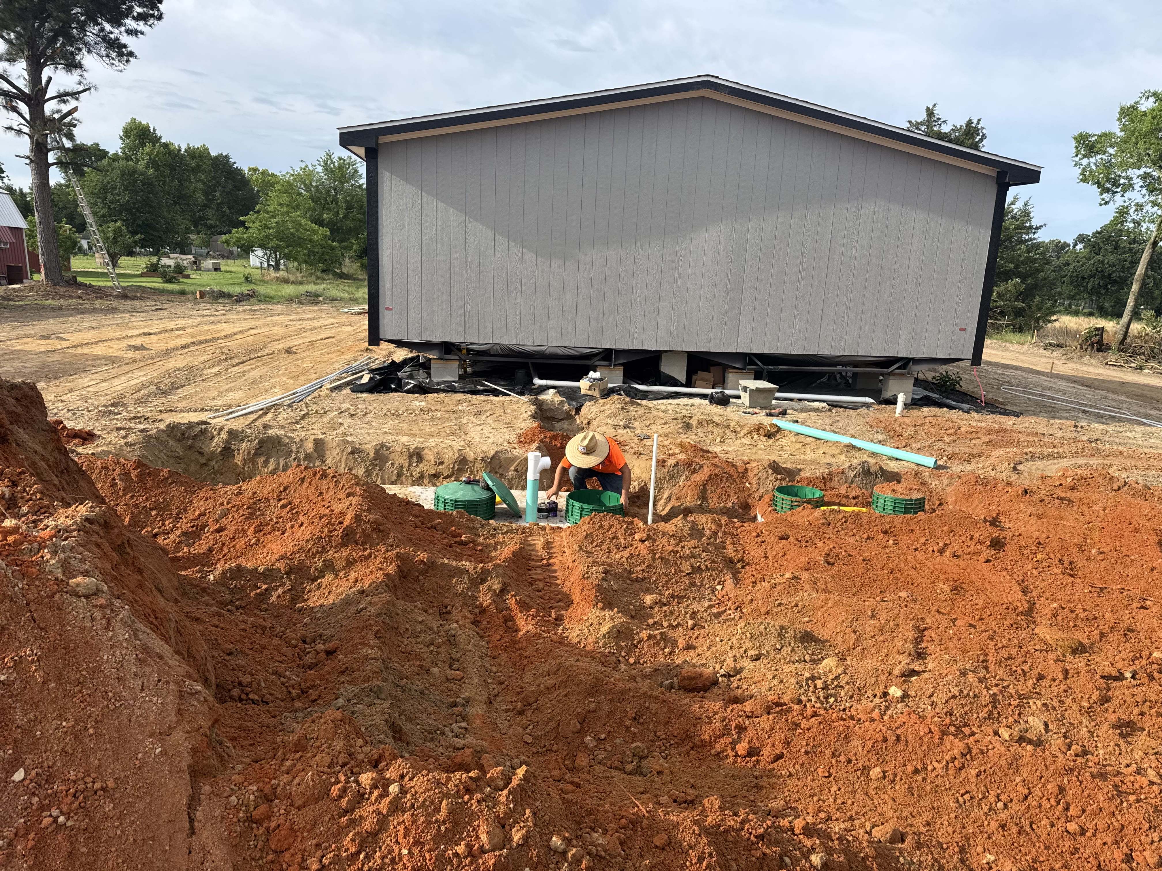 Exterior excavation and underground plumbing work at the Gresham job site