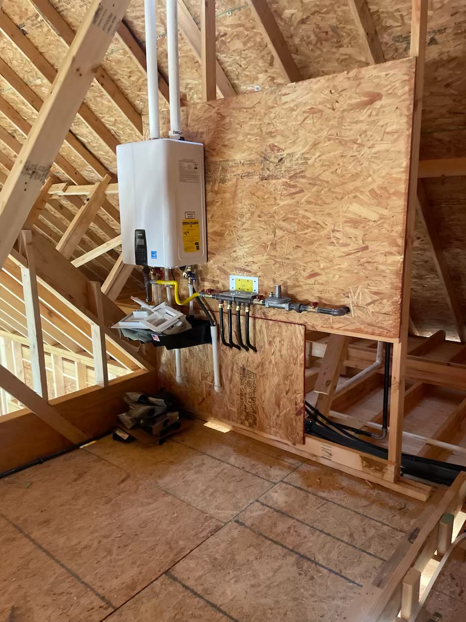 Tankless water heater and attic plumbing rough-in at the Gresham job site