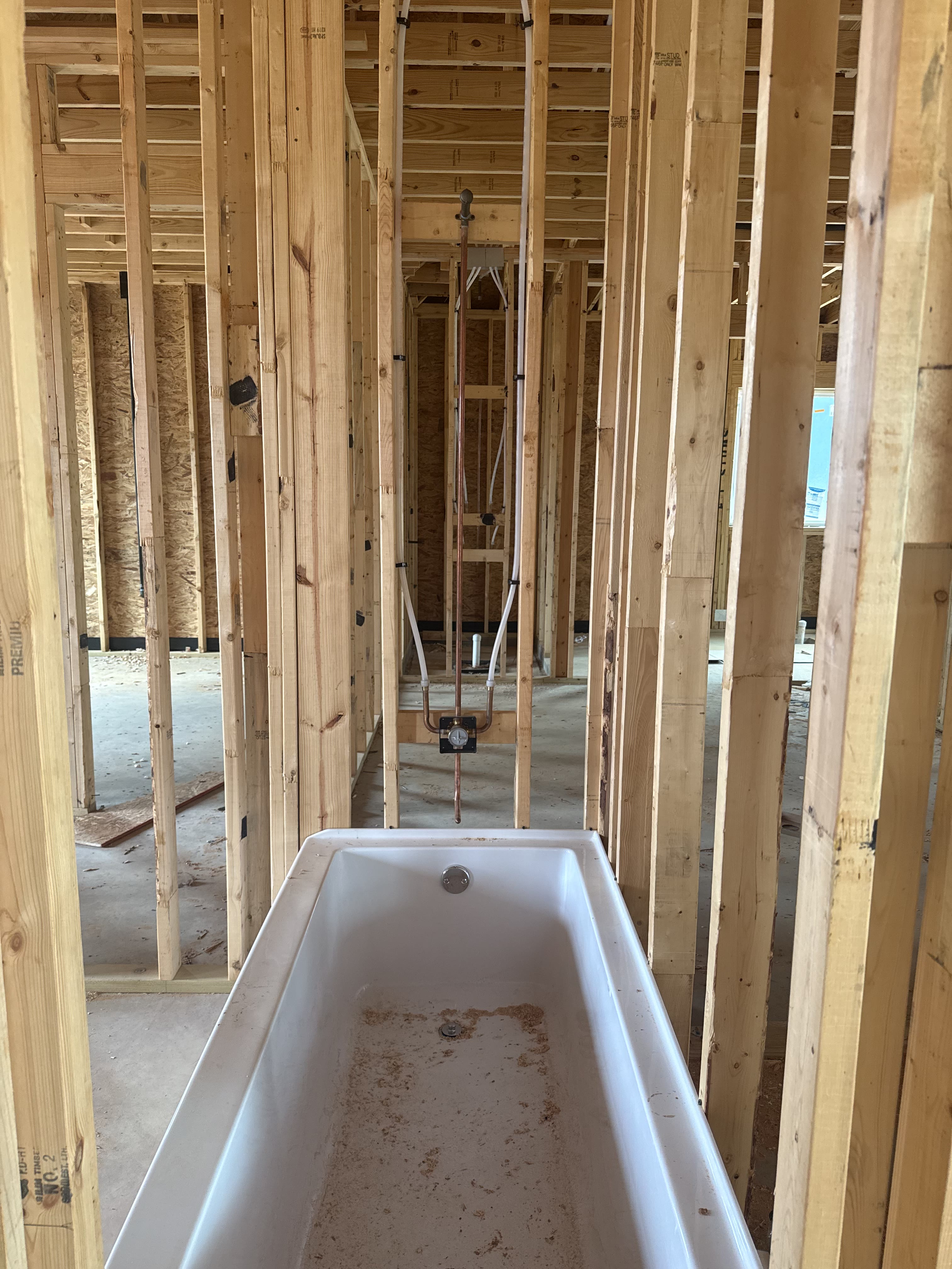 Bathroom plumbing rough-in with tub set at the Gresham job site