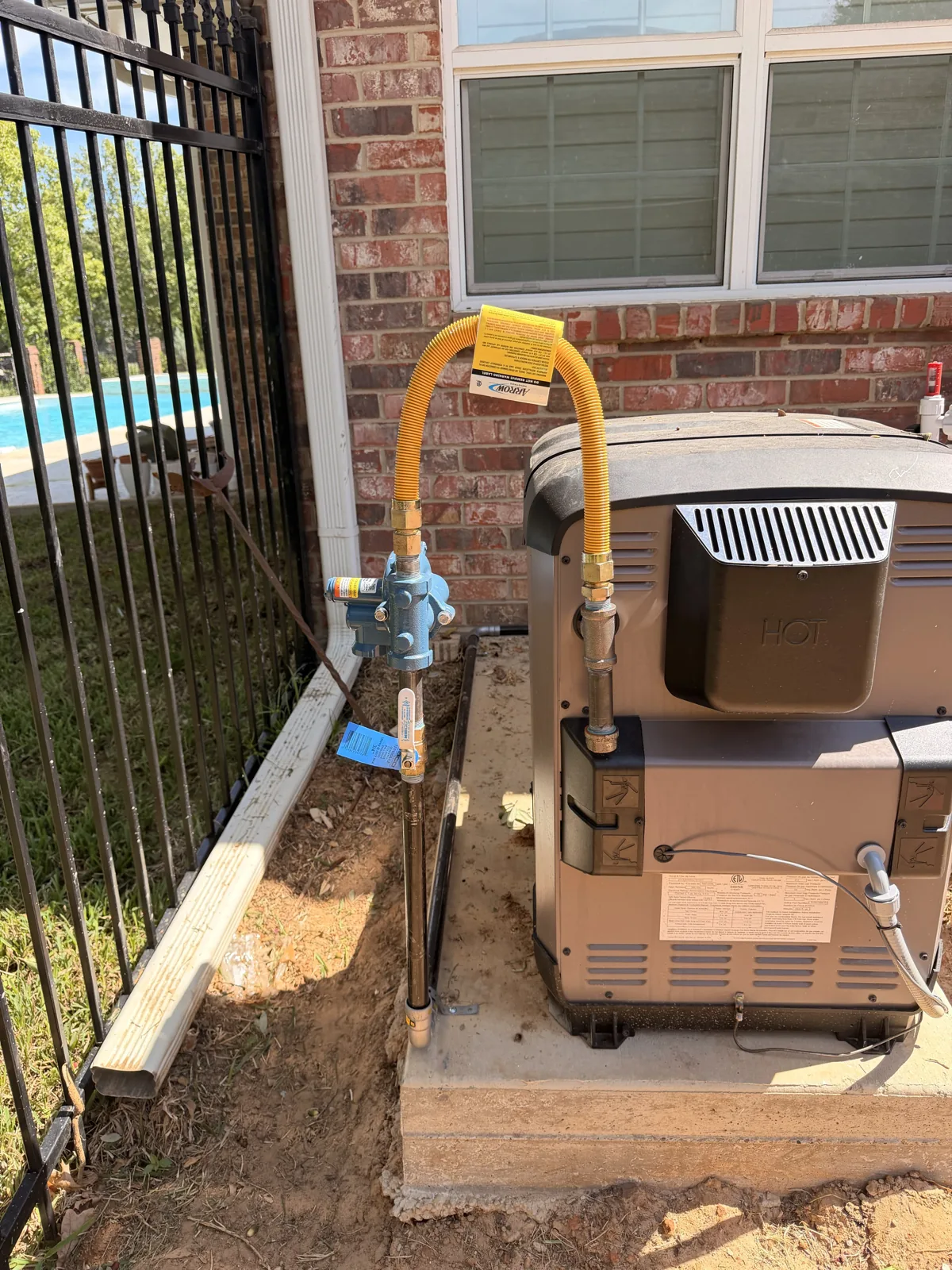 Gas line and flexible connector at a pool heater on Royal Oaks in Hollytree, Tyler TX