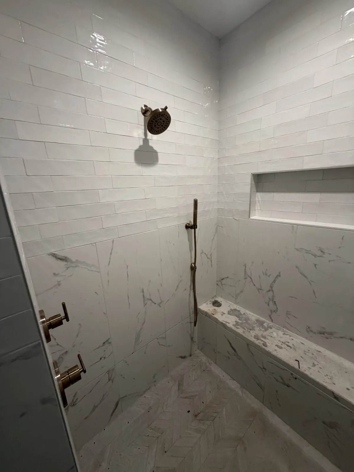 Finished walk-in shower with rain head, handheld shower and valve trim on Hidden Creek Trail, Legacy Bend, Tyler TX