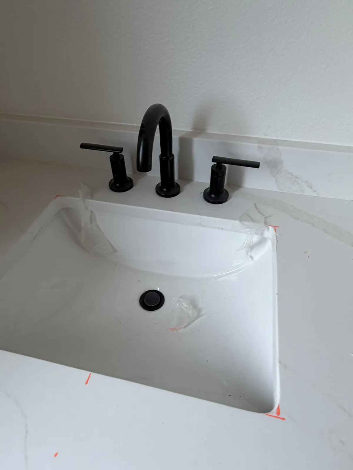 Vanity sink with a widespread black faucet on Hidden Creek Trail, Legacy Bend, Tyler TX