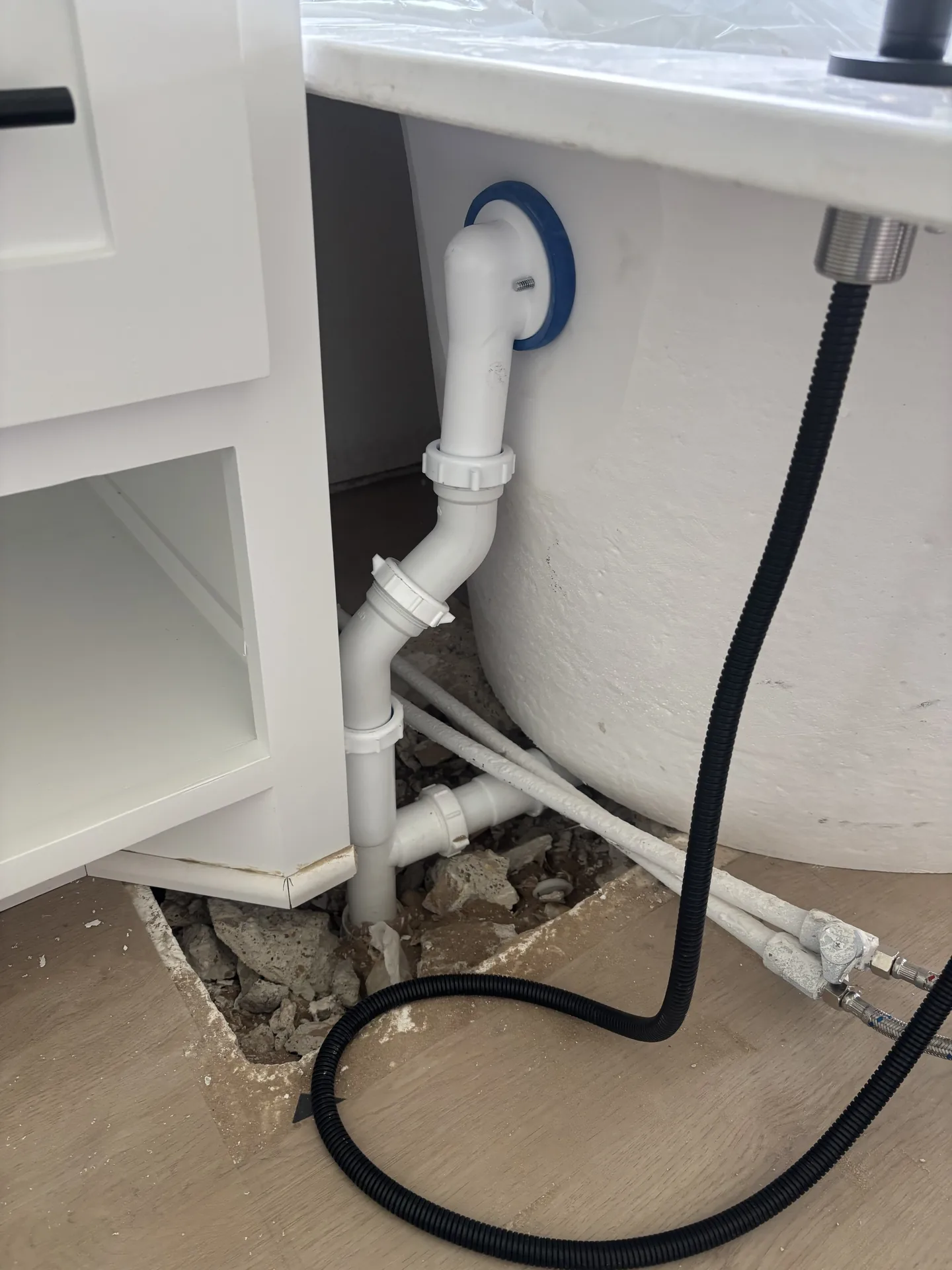 Under sink drain and water connection photo near The Highlands in Tyler Texas